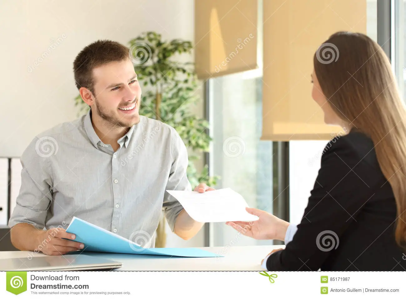 Man Giving Resume In A Job Interview Stock Image